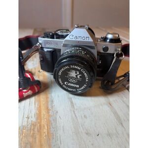 Canon AE-1 Program 35mm Film Camera FD 50mm f/1.8 Lens WORKS + 1984 Olympics Cap